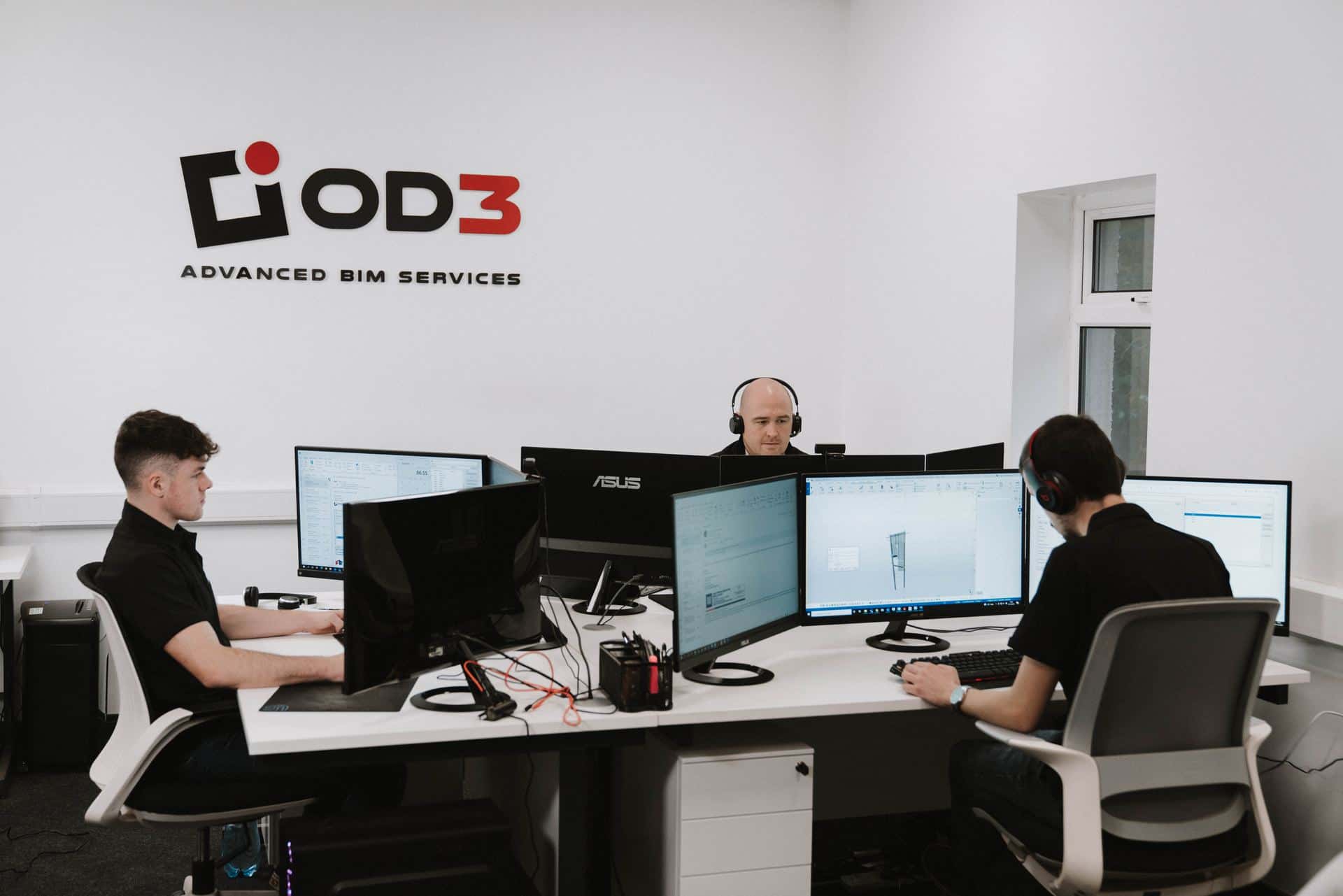 The OD3 studio: engineers at multi-monitor Tekla workstations beneath the OD3 logo