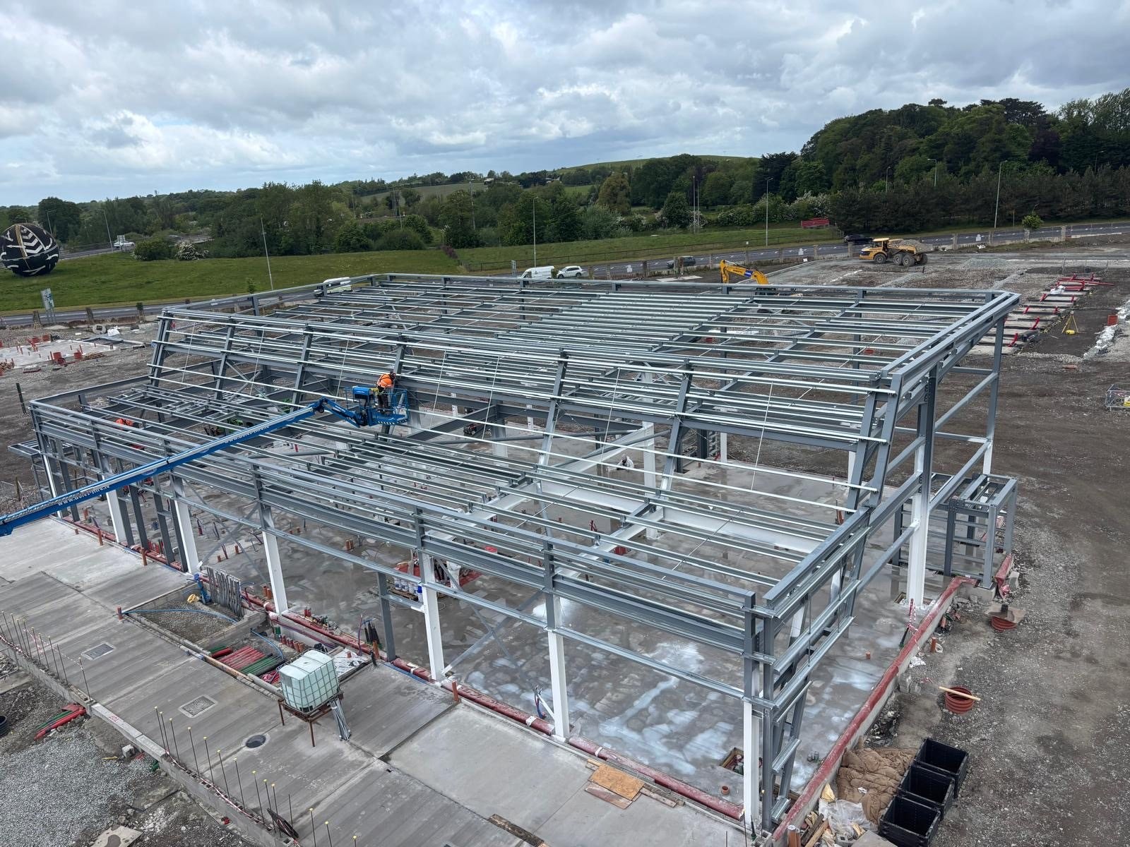 Drone view of a detailed steel frame going up on site at Applegreen Naas